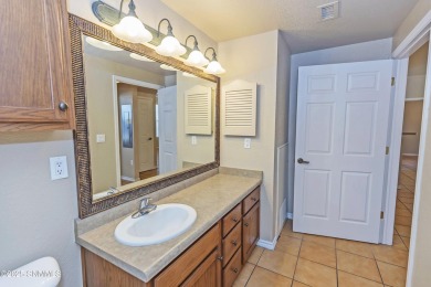 Nestled in a gated condominium community near a golf course and on Sonoma Ranch Golf Course in New Mexico - for sale on GolfHomes.com, golf home, golf lot