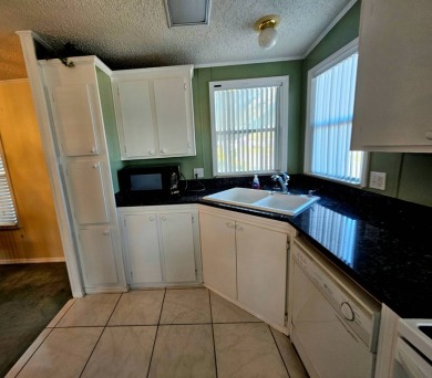 This home is on leased land. Buyers do not own the land. This on Big Cypress Golf and Country Club in Florida - for sale on GolfHomes.com, golf home, golf lot