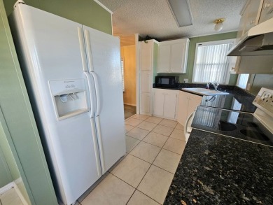 This home is on leased land. Buyers do not own the land. This on Big Cypress Golf and Country Club in Florida - for sale on GolfHomes.com, golf home, golf lot