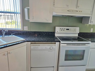 This home is on leased land. Buyers do not own the land. This on Big Cypress Golf and Country Club in Florida - for sale on GolfHomes.com, golf home, golf lot