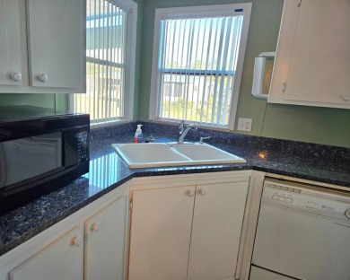 This home is on leased land. Buyers do not own the land. This on Big Cypress Golf and Country Club in Florida - for sale on GolfHomes.com, golf home, golf lot