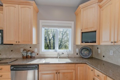 This Exceptional Twin Home sits on a picturesque lot overlooking on Emerald Hills Golf Club in Iowa - for sale on GolfHomes.com, golf home, golf lot