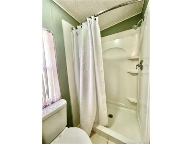 Lovely home with a new A/C in 2021. New washer & dryer and on Indianwood Golf and Country Club in Florida - for sale on GolfHomes.com, golf home, golf lot