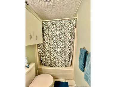 Lovely home with a new A/C in 2021. New washer & dryer and on Indianwood Golf and Country Club in Florida - for sale on GolfHomes.com, golf home, golf lot