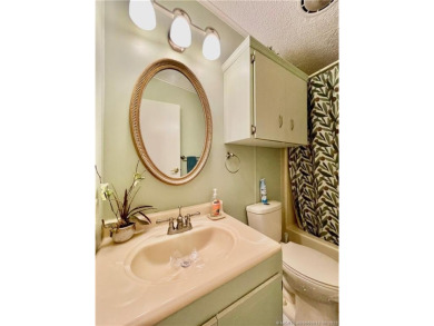 Lovely home with a new A/C in 2021. New washer & dryer and on Indianwood Golf and Country Club in Florida - for sale on GolfHomes.com, golf home, golf lot