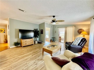Lovely home with a new A/C in 2021. New washer & dryer and on Indianwood Golf and Country Club in Florida - for sale on GolfHomes.com, golf home, golf lot