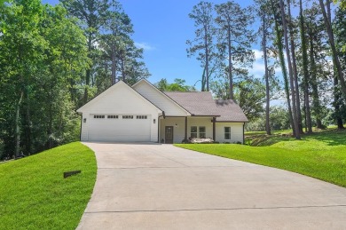Enjoy peaceful living with golf course views in this beautifully on Rayburn Country Club in Texas - for sale on GolfHomes.com, golf home, golf lot