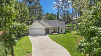 Enjoy peaceful living with golf course views in this beautifully on Rayburn Country Club in Texas - for sale on GolfHomes.com, golf home, golf lot