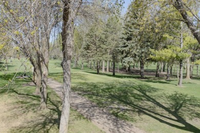 This Exceptional Twin Home sits on a picturesque lot overlooking on Emerald Hills Golf Club in Iowa - for sale on GolfHomes.com, golf home, golf lot