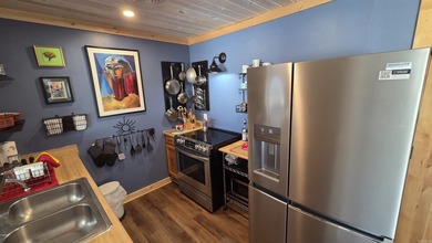 Rare ground-level 2 bed, 2 bath condo with carport and extra on Indian Hills Country Club in Arkansas - for sale on GolfHomes.com, golf home, golf lot