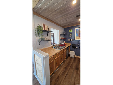 Rare ground-level 2 bed, 2 bath condo with carport and extra on Indian Hills Country Club in Arkansas - for sale on GolfHomes.com, golf home, golf lot