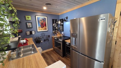 Rare ground-level 2 bed, 2 bath condo with carport and extra on Indian Hills Country Club in Arkansas - for sale on GolfHomes.com, golf home, golf lot