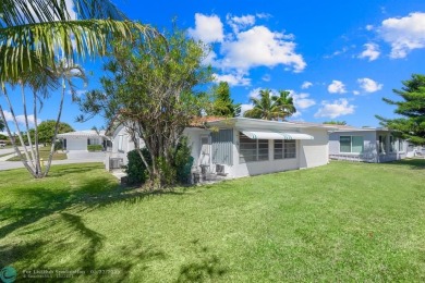 Beautiful 2 bed, 1 bath, garage corner lot with pleasant, quaint on Woodlands Country Club in Florida - for sale on GolfHomes.com, golf home, golf lot