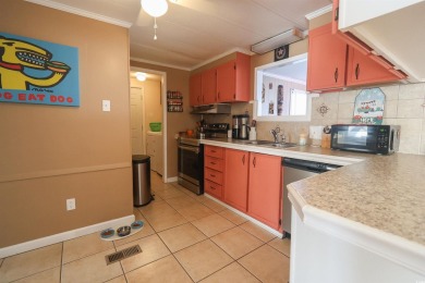 Discover coastal living at its finest in this charming 3-bedroom on Eagle Nest Golf Club in South Carolina - for sale on GolfHomes.com, golf home, golf lot