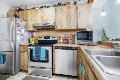 Fabulous Opportunity: charming one-story corner townhome in on Pembroke Lakes Golf Club in Florida - for sale on GolfHomes.com, golf home, golf lot