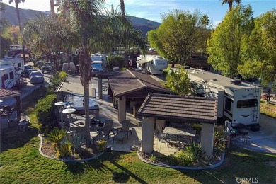 Check out the gated entry to this incredible waterfront on Rancho California RV Resort in California - for sale on GolfHomes.com, golf home, golf lot