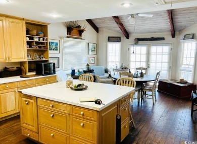 Welcome to 75 Marsh Hen Drive, a truly exceptional creekfront on Pawleys Plantation Golf and Country Club in South Carolina - for sale on GolfHomes.com, golf home, golf lot