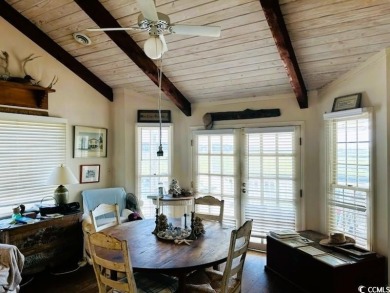 Welcome to 75 Marsh Hen Drive, a truly exceptional creekfront on Pawleys Plantation Golf and Country Club in South Carolina - for sale on GolfHomes.com, golf home, golf lot