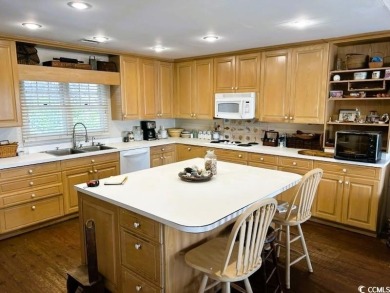 Welcome to 75 Marsh Hen Drive, a truly exceptional creekfront on Pawleys Plantation Golf and Country Club in South Carolina - for sale on GolfHomes.com, golf home, golf lot