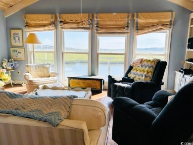 Welcome to 75 Marsh Hen Drive, a truly exceptional creekfront on Pawleys Plantation Golf and Country Club in South Carolina - for sale on GolfHomes.com, golf home, golf lot