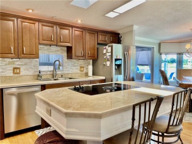 Exquisite home w/a lake & golf course view! Metal roof 3 yrs old on Indianwood Golf and Country Club in Florida - for sale on GolfHomes.com, golf home, golf lot