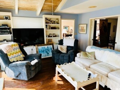 Welcome to 75 Marsh Hen Drive, a truly exceptional creekfront on Pawleys Plantation Golf and Country Club in South Carolina - for sale on GolfHomes.com, golf home, golf lot