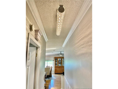 Exquisite home w/a lake & golf course view! Metal roof 3 yrs old on Indianwood Golf and Country Club in Florida - for sale on GolfHomes.com, golf home, golf lot