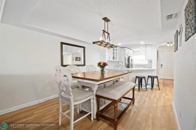 This updated condo features a spacious living area with an on Boca Dunes Golf and Country Club in Florida - for sale on GolfHomes.com, golf home, golf lot
