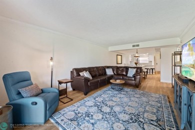 This updated condo features a spacious living area with an on Boca Dunes Golf and Country Club in Florida - for sale on GolfHomes.com, golf home, golf lot