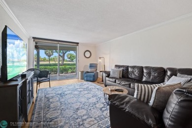 This updated condo features a spacious living area with an on Boca Dunes Golf and Country Club in Florida - for sale on GolfHomes.com, golf home, golf lot