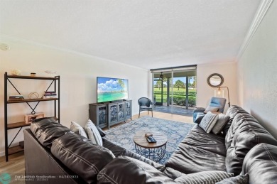 This updated condo features a spacious living area with an on Boca Dunes Golf and Country Club in Florida - for sale on GolfHomes.com, golf home, golf lot