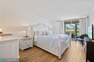 This updated condo features a spacious living area with an on Boca Dunes Golf and Country Club in Florida - for sale on GolfHomes.com, golf home, golf lot