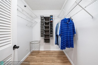 This updated condo features a spacious living area with an on Boca Dunes Golf and Country Club in Florida - for sale on GolfHomes.com, golf home, golf lot