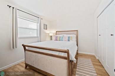 This updated condo features a spacious living area with an on Boca Dunes Golf and Country Club in Florida - for sale on GolfHomes.com, golf home, golf lot