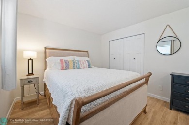 This updated condo features a spacious living area with an on Boca Dunes Golf and Country Club in Florida - for sale on GolfHomes.com, golf home, golf lot