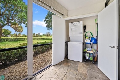 This updated condo features a spacious living area with an on Boca Dunes Golf and Country Club in Florida - for sale on GolfHomes.com, golf home, golf lot