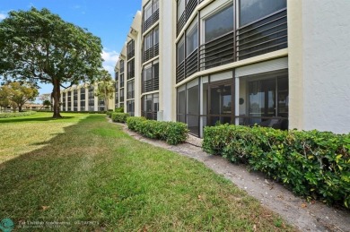 This updated condo features a spacious living area with an on Boca Dunes Golf and Country Club in Florida - for sale on GolfHomes.com, golf home, golf lot