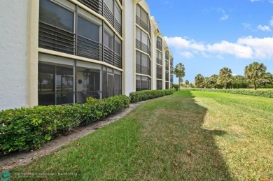 This updated condo features a spacious living area with an on Boca Dunes Golf and Country Club in Florida - for sale on GolfHomes.com, golf home, golf lot