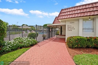This updated condo features a spacious living area with an on Boca Dunes Golf and Country Club in Florida - for sale on GolfHomes.com, golf home, golf lot