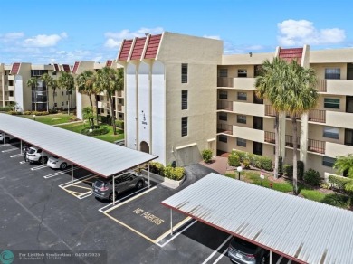 This updated condo features a spacious living area with an on Boca Dunes Golf and Country Club in Florida - for sale on GolfHomes.com, golf home, golf lot