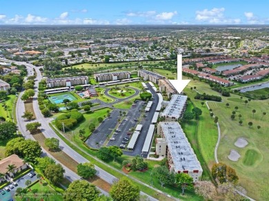 This updated condo features a spacious living area with an on Boca Dunes Golf and Country Club in Florida - for sale on GolfHomes.com, golf home, golf lot