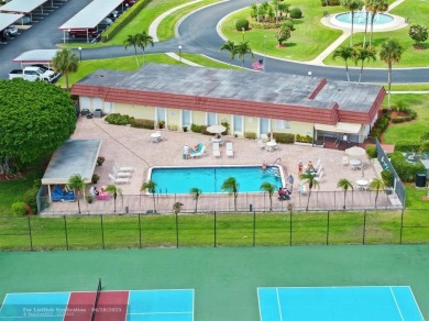 This updated condo features a spacious living area with an on Boca Dunes Golf and Country Club in Florida - for sale on GolfHomes.com, golf home, golf lot