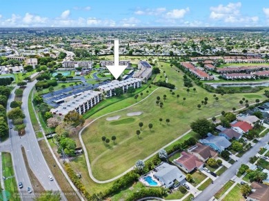 This updated condo features a spacious living area with an on Boca Dunes Golf and Country Club in Florida - for sale on GolfHomes.com, golf home, golf lot