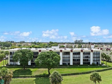This updated condo features a spacious living area with an on Boca Dunes Golf and Country Club in Florida - for sale on GolfHomes.com, golf home, golf lot