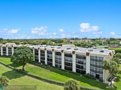 This updated condo features a spacious living area with an on Boca Dunes Golf and Country Club in Florida - for sale on GolfHomes.com, golf home, golf lot