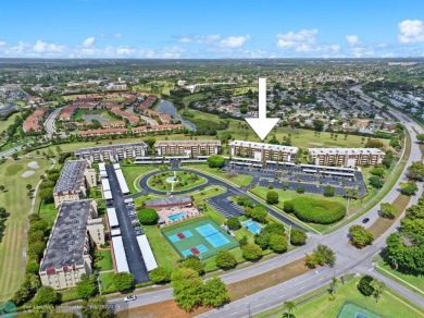 This updated condo features a spacious living area with an on Boca Dunes Golf and Country Club in Florida - for sale on GolfHomes.com, golf home, golf lot