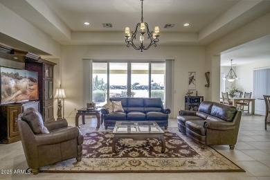 Make this magnificent Treviso model with enchanting water views on Tuscany Falls At Pebble Creek in Arizona - for sale on GolfHomes.com, golf home, golf lot