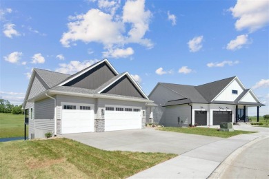 This 2024 Parade of Homes by Hodge Construction overlooks the on Saddleback Ridge Golf Course in Iowa - for sale on GolfHomes.com, golf home, golf lot