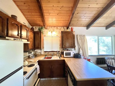 This home in the pines called 'Lil Oak Hill' is beautifully on Pine Mountain Lake Country Club in California - for sale on GolfHomes.com, golf home, golf lot