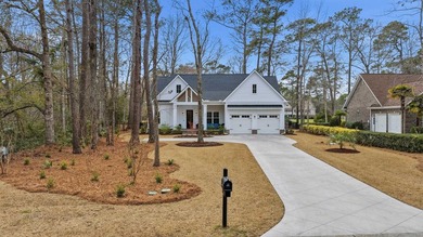 Set within the gated elegance of Pawleys Plantation Golf & on Pawleys Plantation Golf and Country Club in South Carolina - for sale on GolfHomes.com, golf home, golf lot